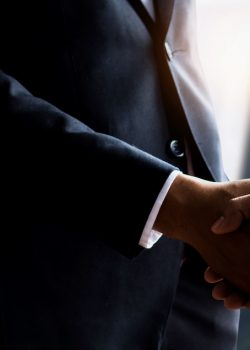 Business people shaking hands, close up hand shake of successful negotiate businessman agreement and success in contract